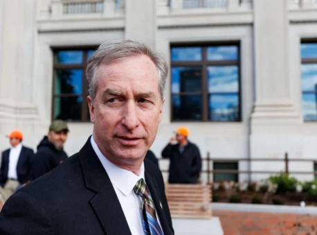 Del. David Bulova (D–Fairfax) answers questions while walking to the Capitol on Monday, January 29, 2024 in Richmond.
